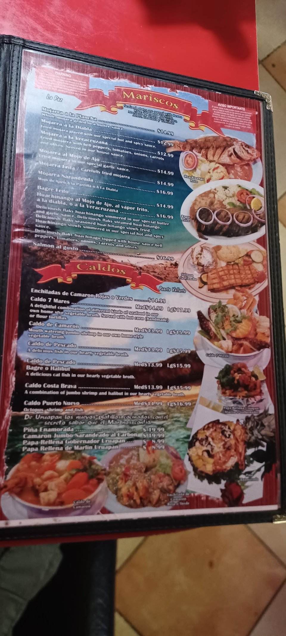 Printed menu with seafood categories and drinks.